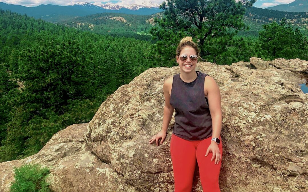 Sydney Richards leaning on a rock